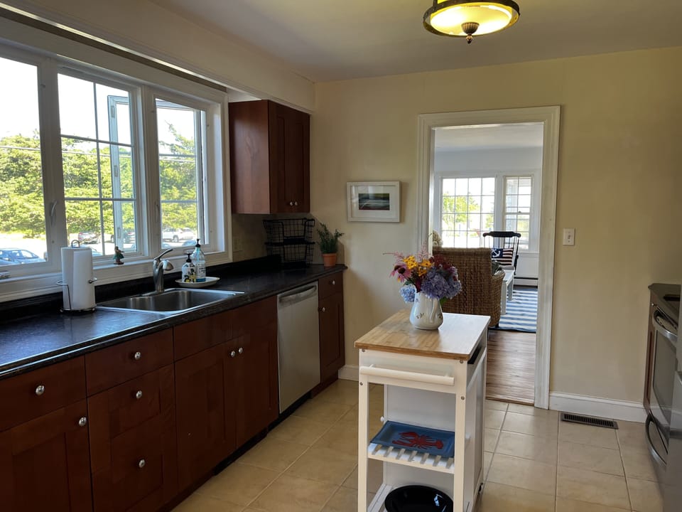 Well appointed kitchen with Breville coffee machine and stainless appliances