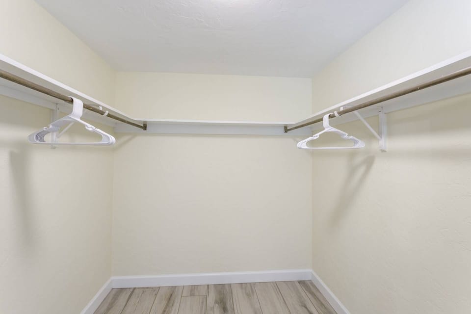 Master walk-in closet.  Plenty of space to put away all your new vacay clothes!
