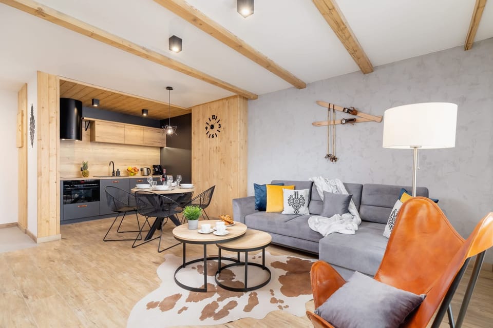 Another perspective of the living room, highlighting its open layout and comfortable seating.