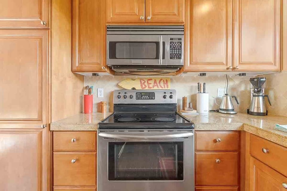 Glass top stove with a microwave range.