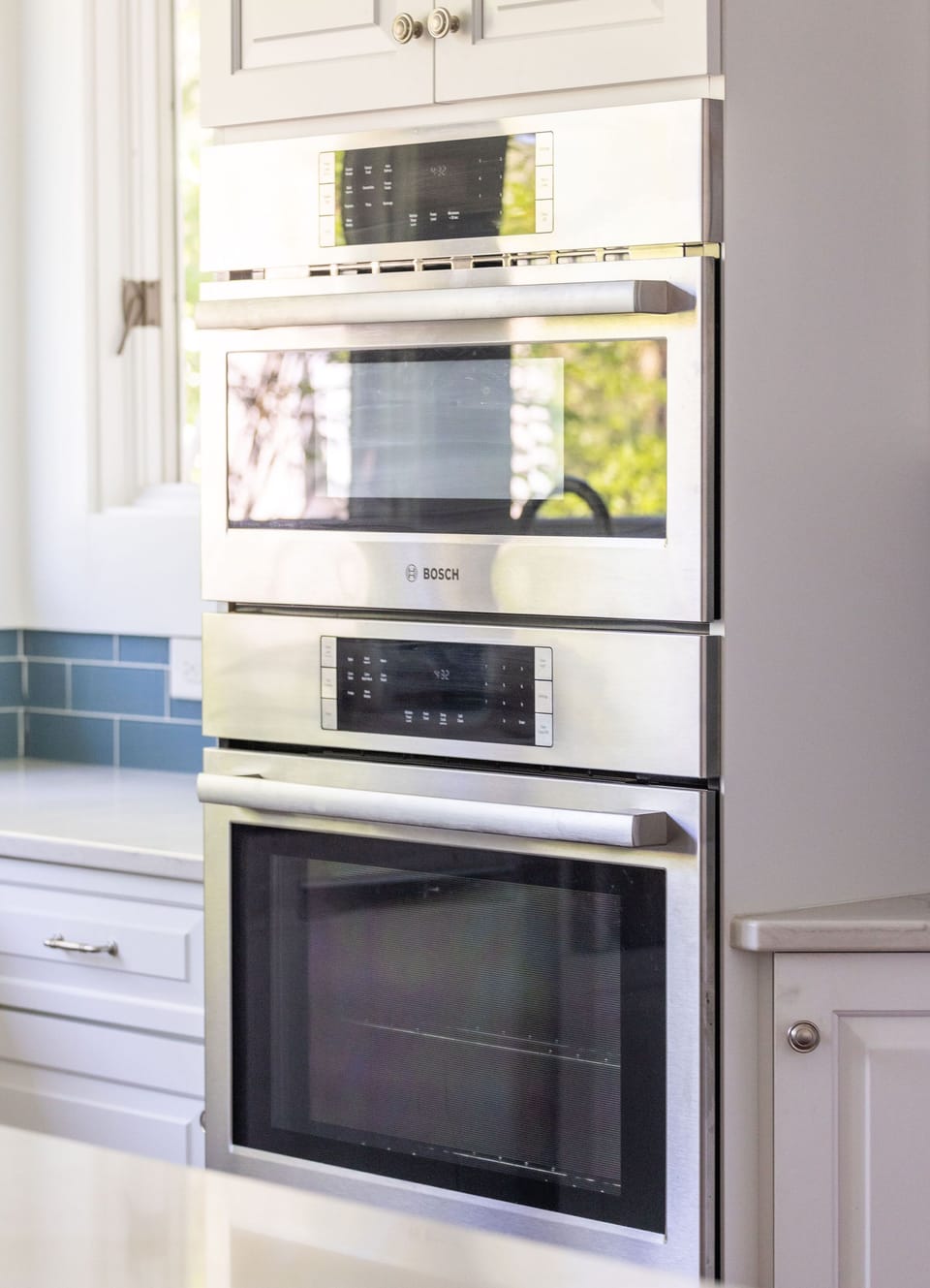 Bright Kitchen with stainless steel appliances and comfortable seating
