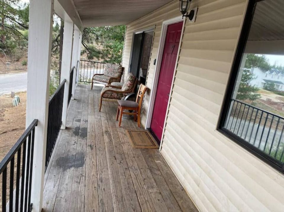 Front entrance of the cabin and porch for relaxation area.