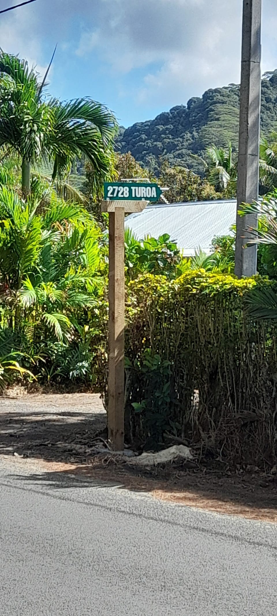 Road Sign Main Road. Follow Road to the last house.