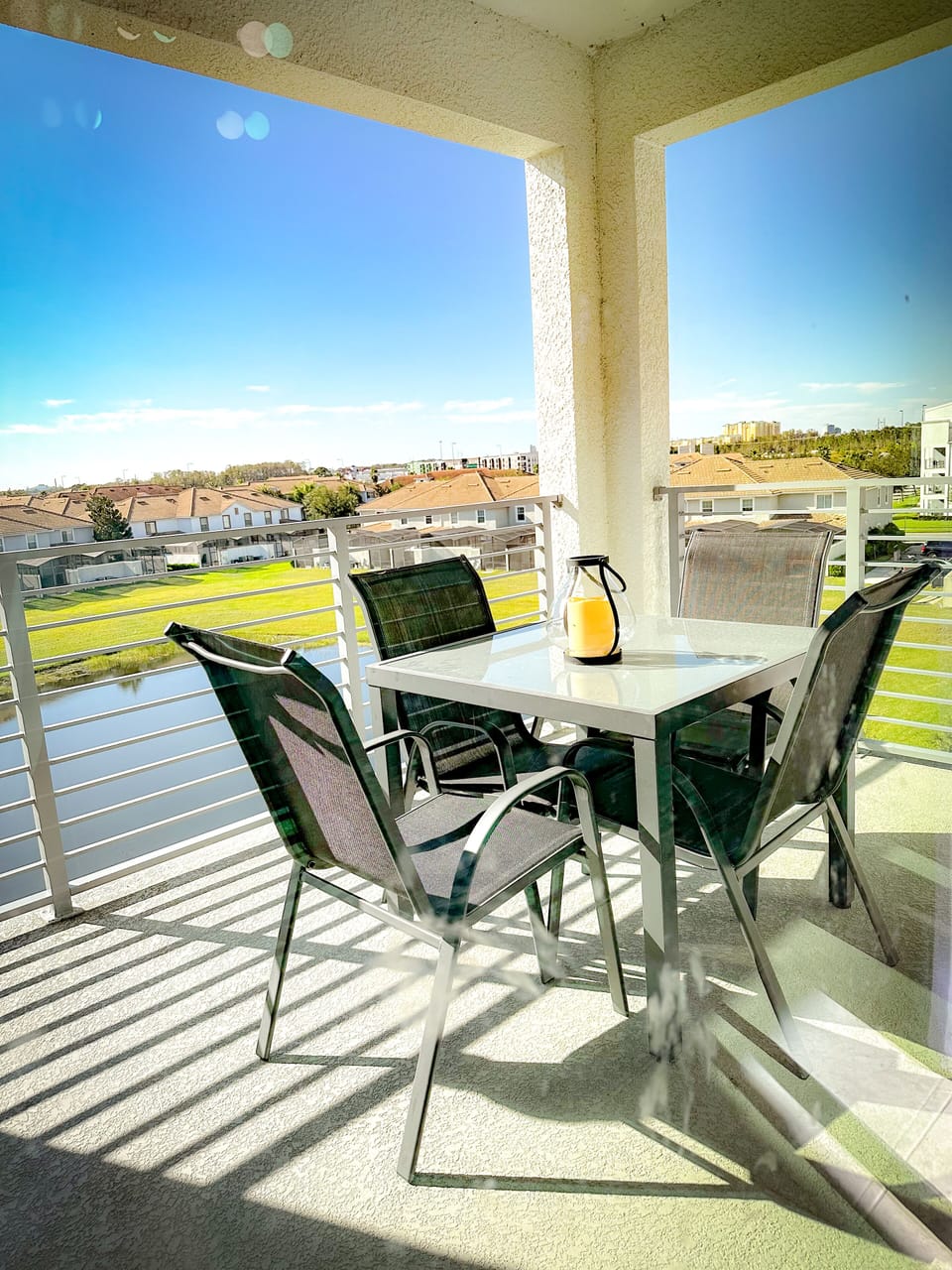 balcony with a lake view and dining area