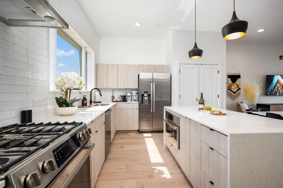 Well equipped Chef's kitchen with coffee bar and eat-in island for extra dining.