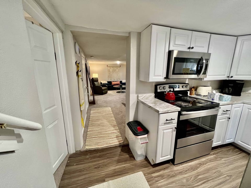 Stairs lead into the kitchen and then into the dining and living room