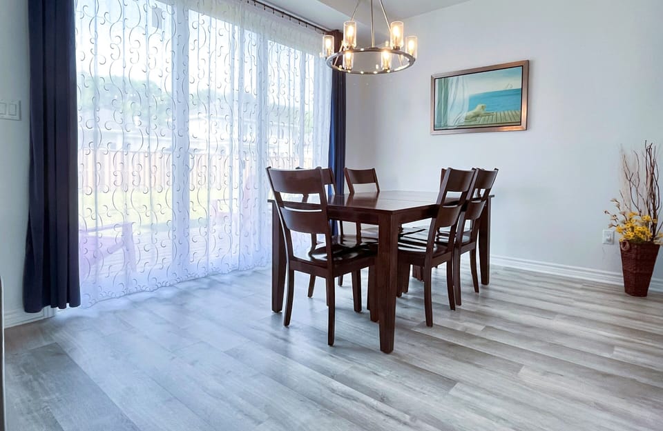 Bright dining area with a wide 10 feet patio door to the deck and backyard
