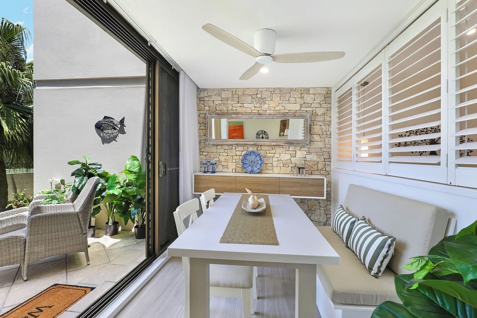Dining area opens onto front courtyard area with ocean views