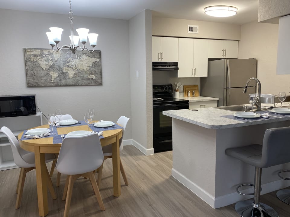 Enjoy a drink or a meal at the dining table or bar chairs.