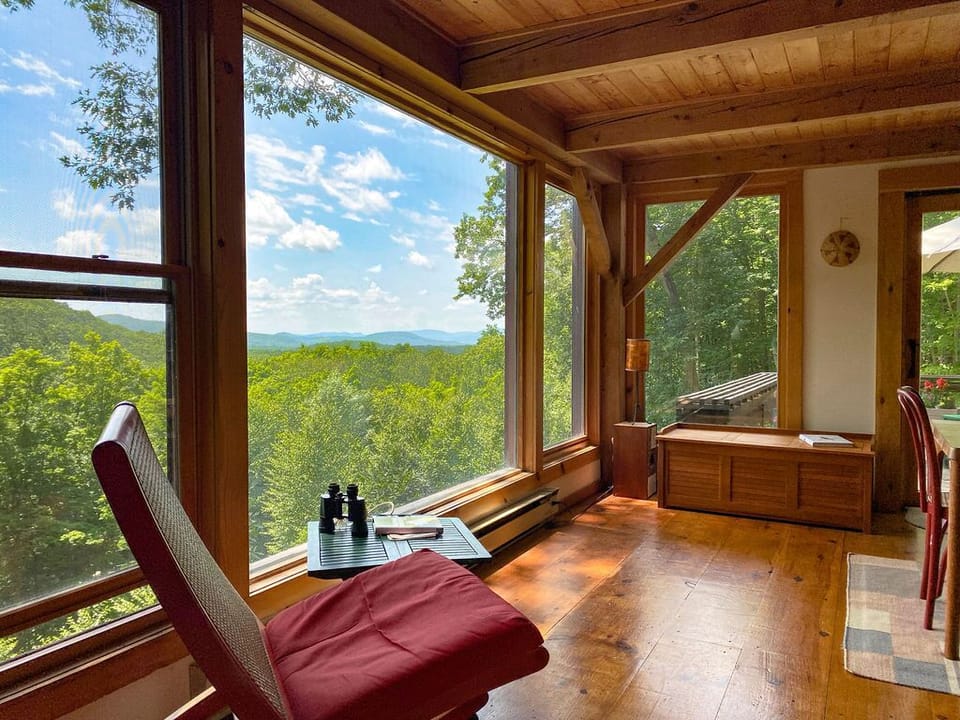 Comfortable living room with beautiful view and wood burning stove.