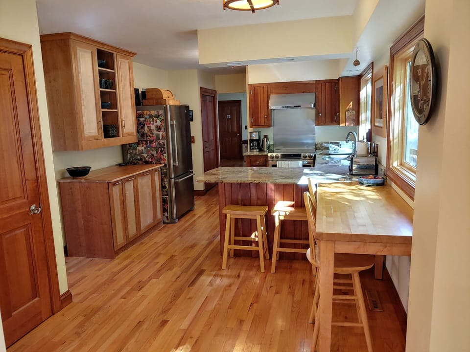 Kitchen with cherry and maple cabinets made by the owner