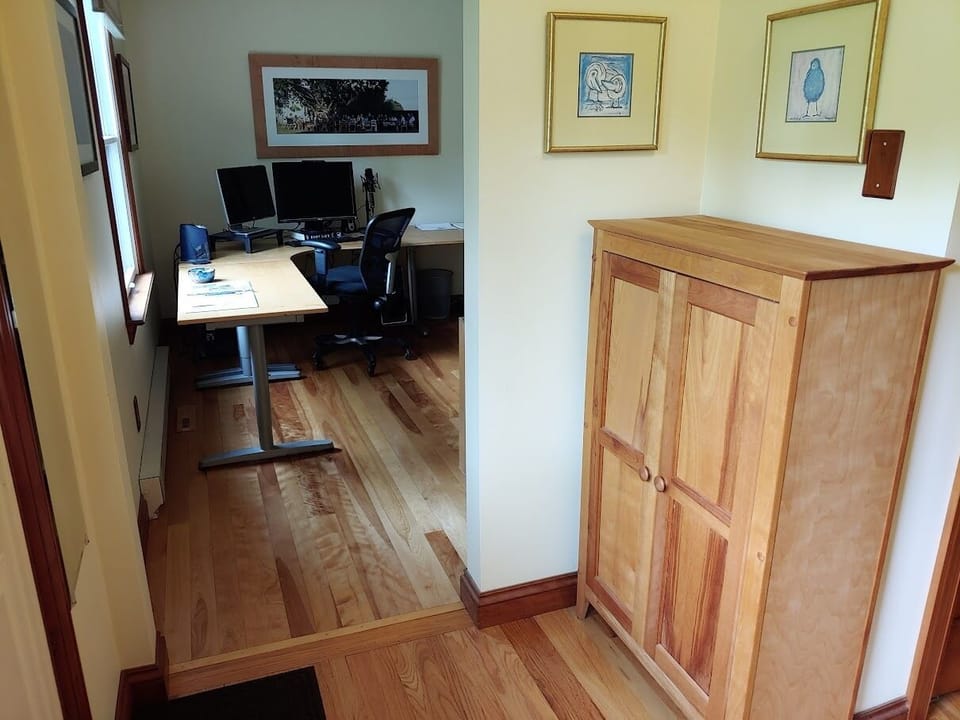 Fron entrance way leads to the computer room and kitchen and stairway