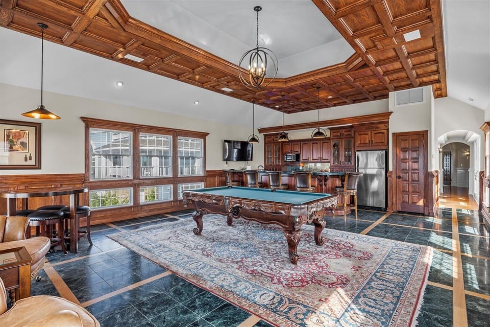 Billiards Room - Full sized appliances, custom features and designs are sure to wow in this game lounge.