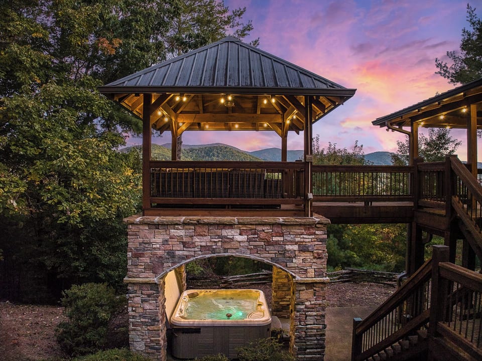 The covered gazebo, perfect for stargazing and taking a dip in the cozy jacuzzi.