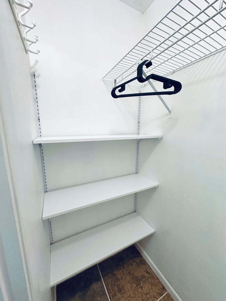 Primary room closet with shelves