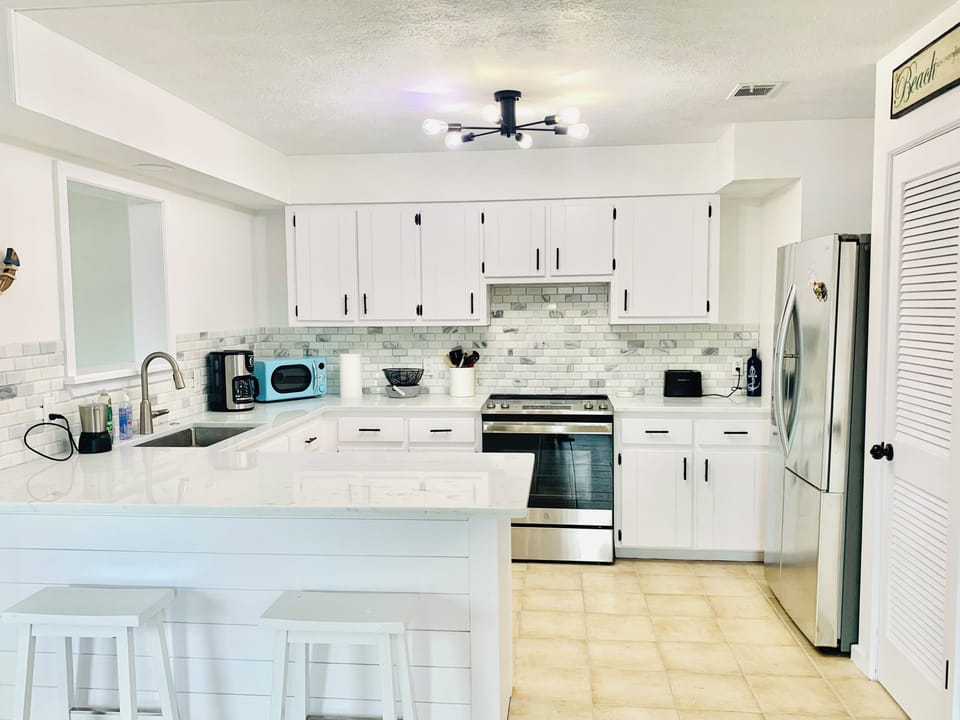 Well equipped kitchen w/ island - open concept.
