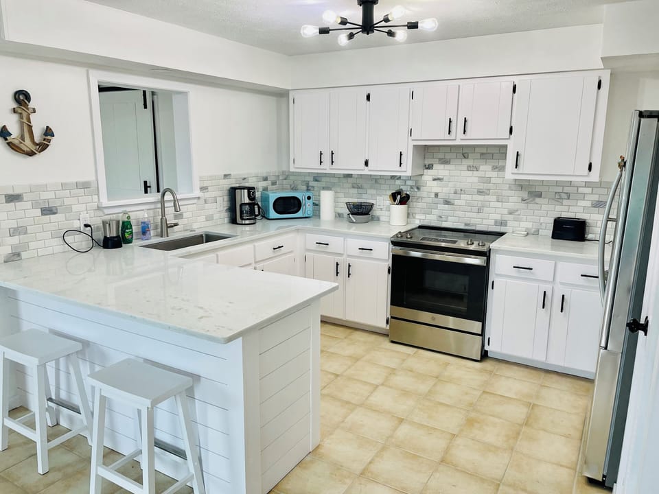 Well equipped kitchen w/ island - open concept.