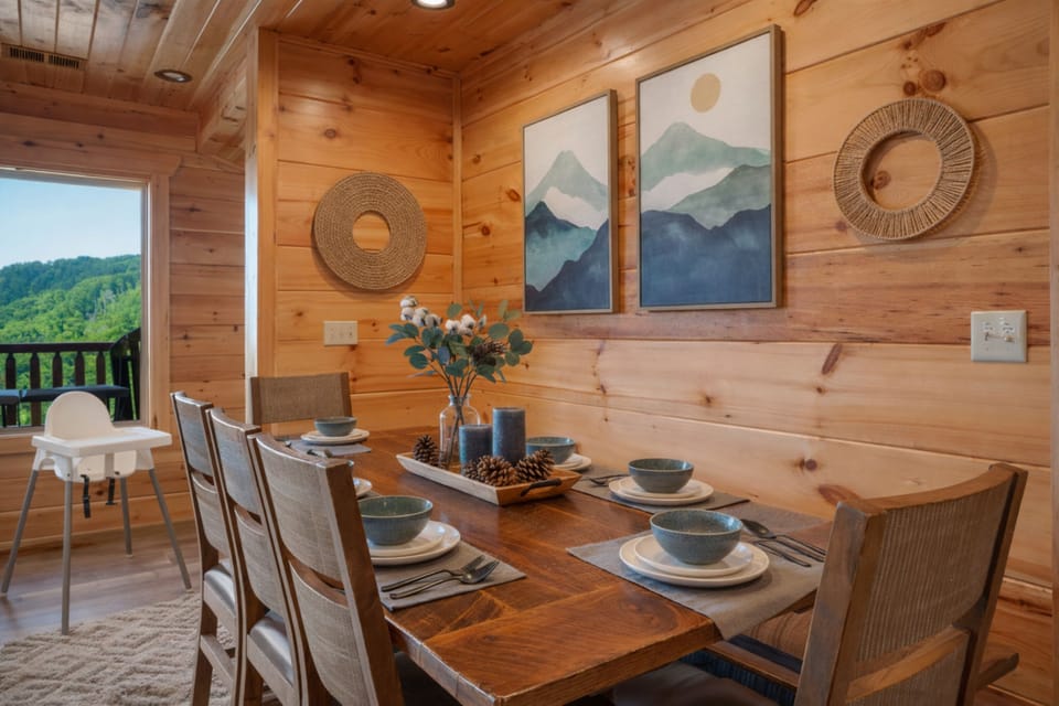 Cozy cabin dining nook for six with mountain views and chic decor