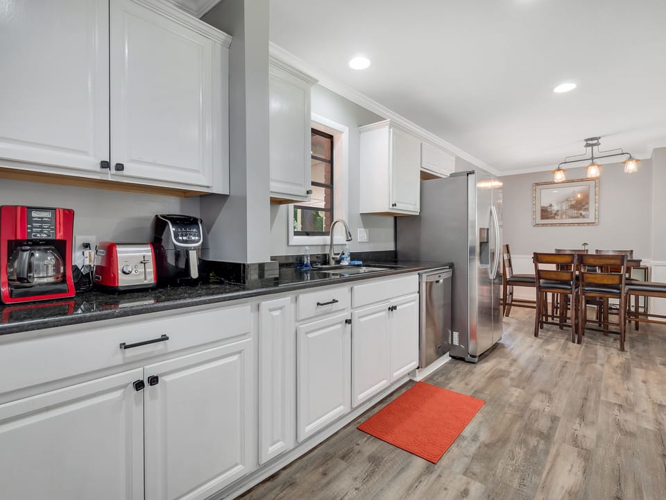 Gally style kitchen with coffee/tea station.