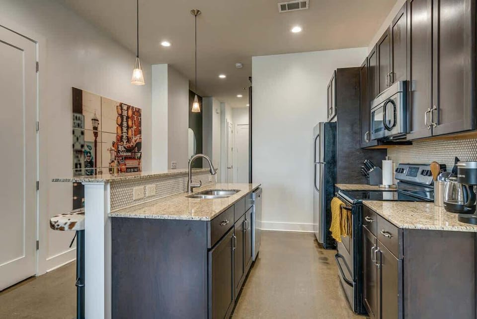 Fully equipped kitchen with your basic cooking essentials and complete with stainless steel appliances.