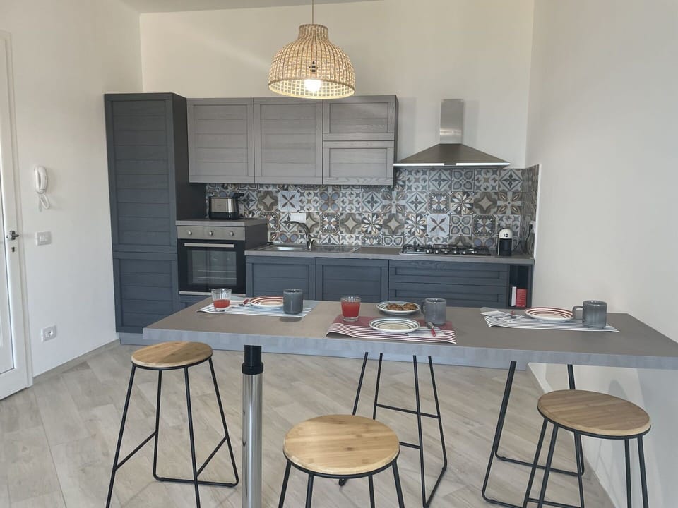 Table, Property, Furniture, Cabinetry, Wood, Interior Design, Lighting, Flooring, Countertop, Floor