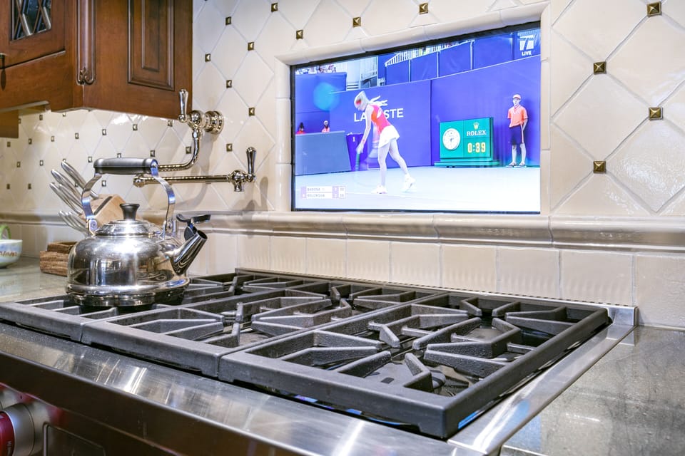 Oven range with tv built into the wall so you never miss a moment. 