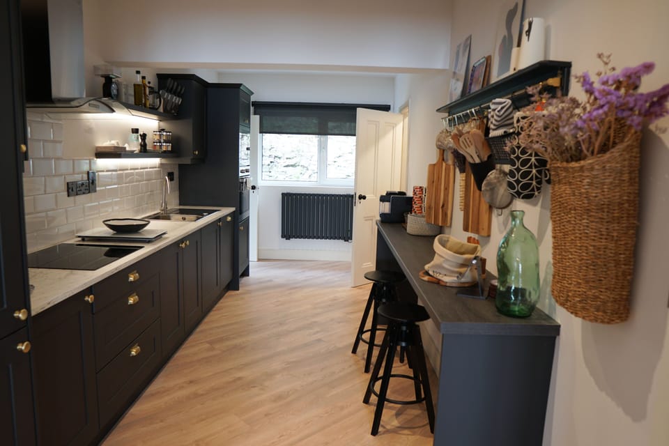 A spacious kitchen with separate laundry room