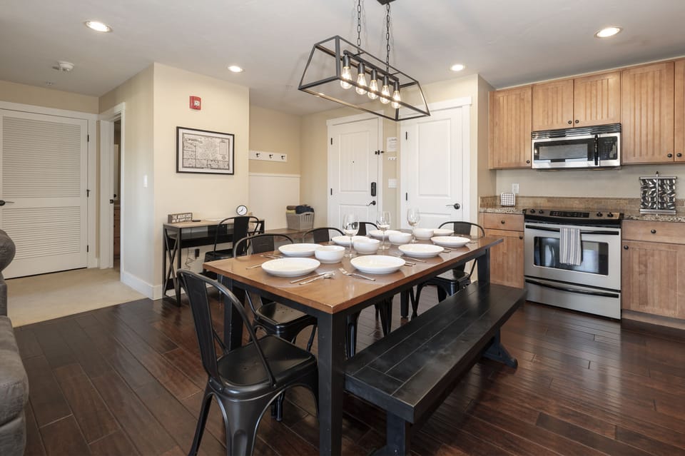Expansive wooden dining table with bench seating, perfect place for memorable meals