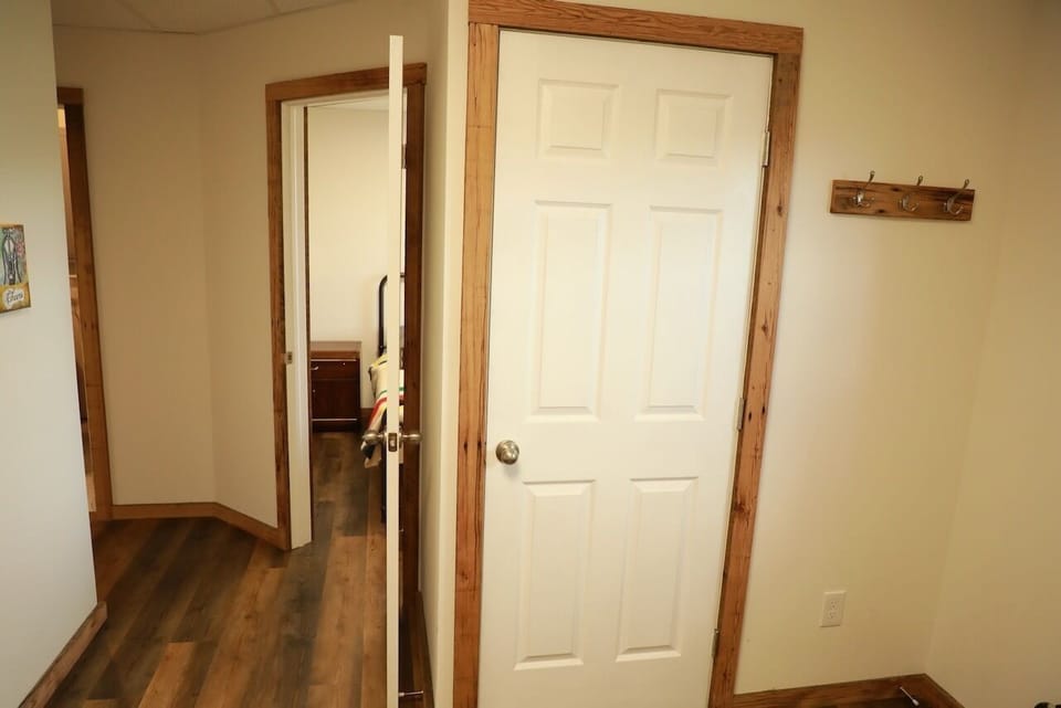 Closet in entrance area with hooks to hang things