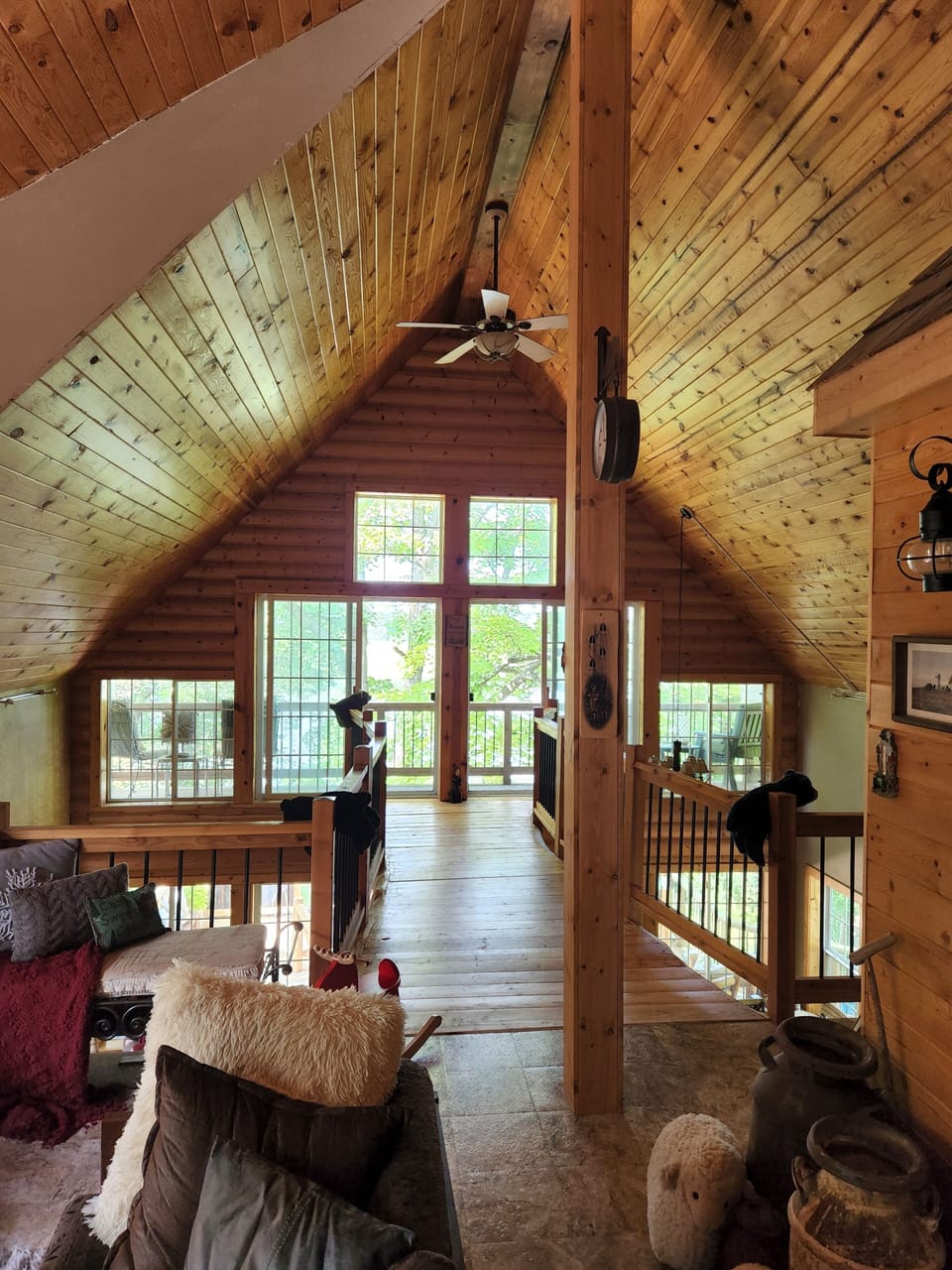 loft living room,  with bridge that leads to upper deck .
