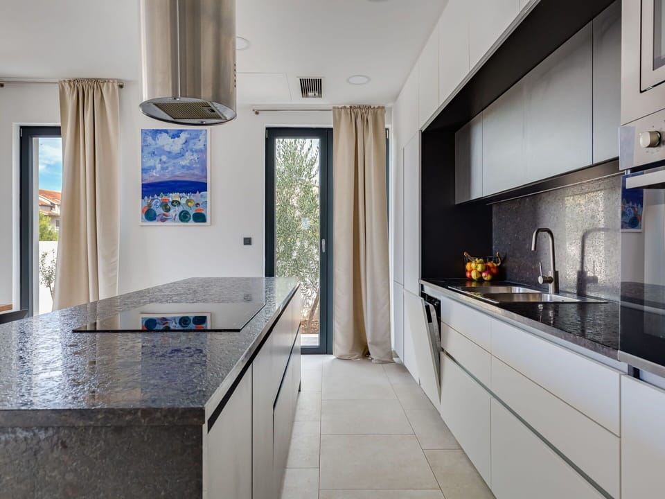 Countertop, Cabinetry, Property, Furniture, Building, Kitchen, Kitchen Appliance, Kitchen Sink, Tap, Interior Design