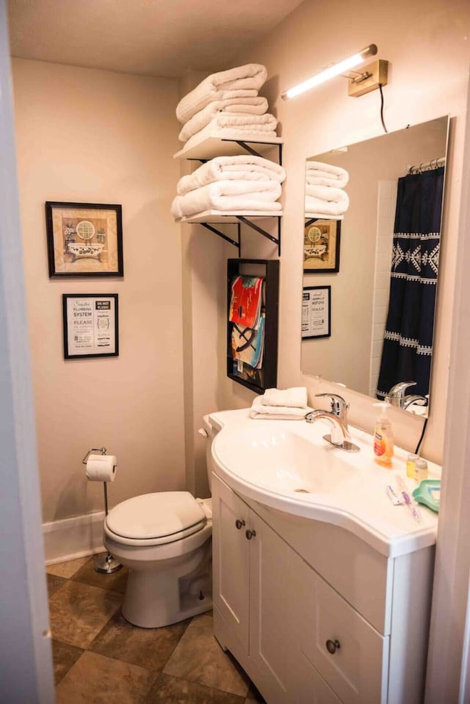 The restroom includes a surprisingly larger vanity, some additional lighting and of course fluffy white bath towels, washcloths and a hand towel for your stay, as well as ample toilet paper