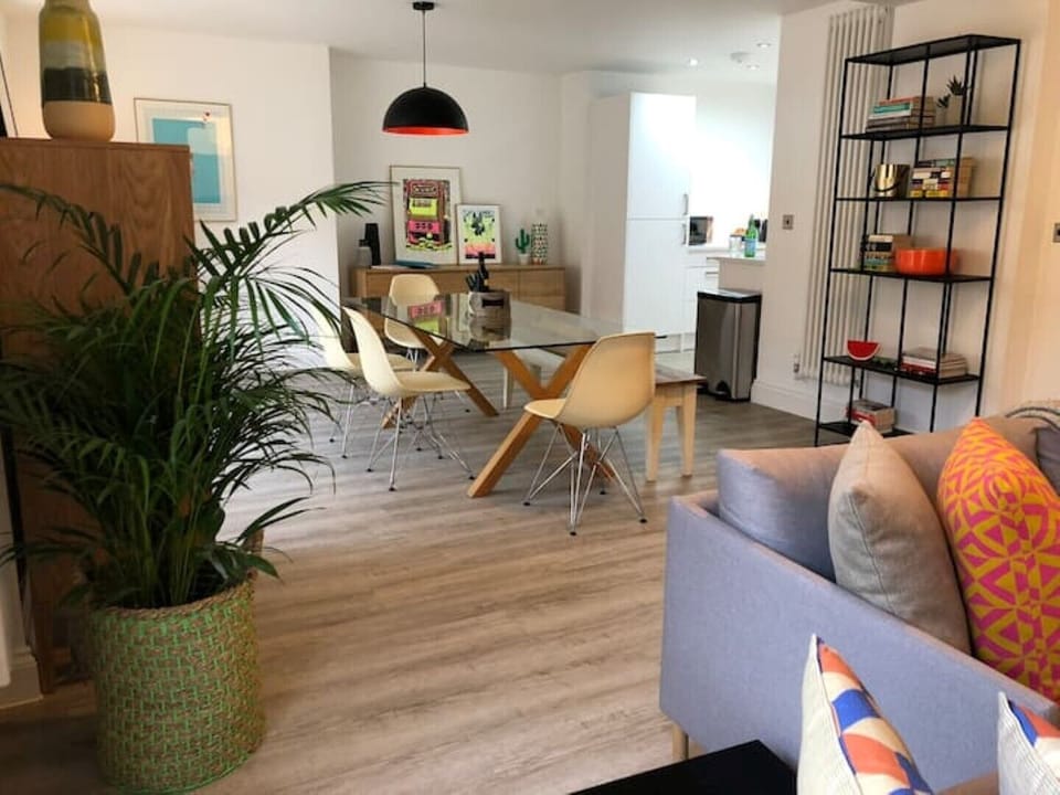 Living area with sofa seating and dining for 8 people.