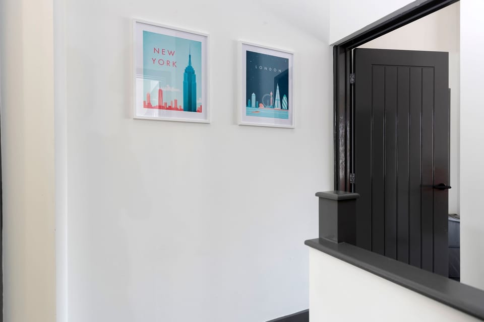 A bright entrance area with tasteful artwork and a welcoming view into the home.