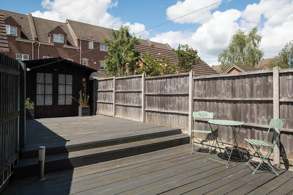A serene garden with decking, offering a lovely spot to enjoy the outdoors