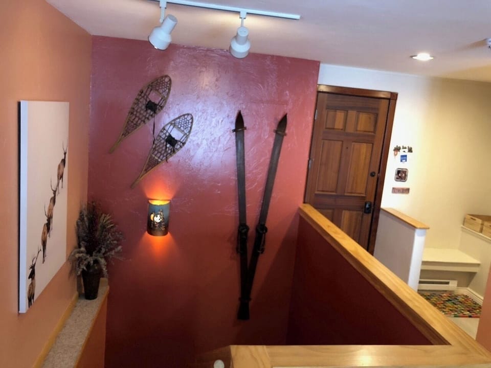 The stairs to the bottom floor and the door you just walked in.