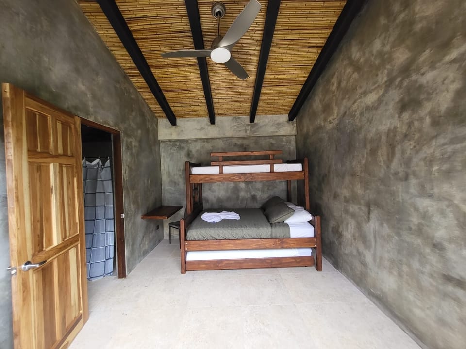 The bunk room with 2 single beds and one double bed 