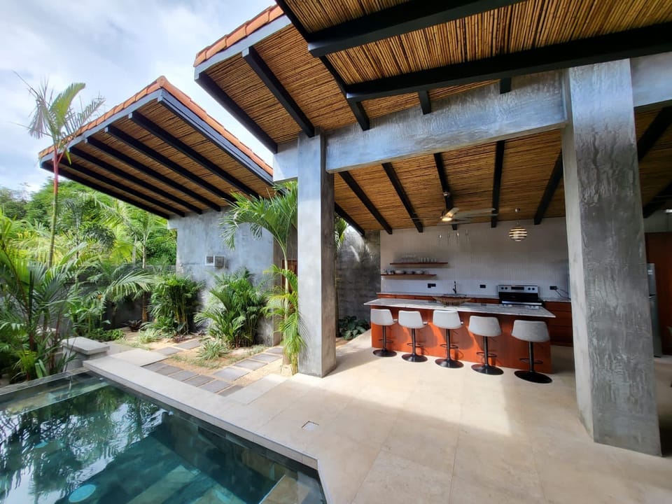 all surrounded by lush tropical plants. The perfect blend of comfort and nature.