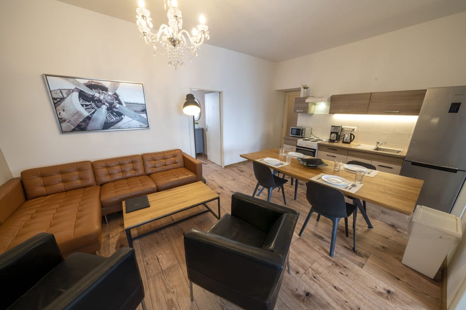 Living room with kitchenette and large dining room