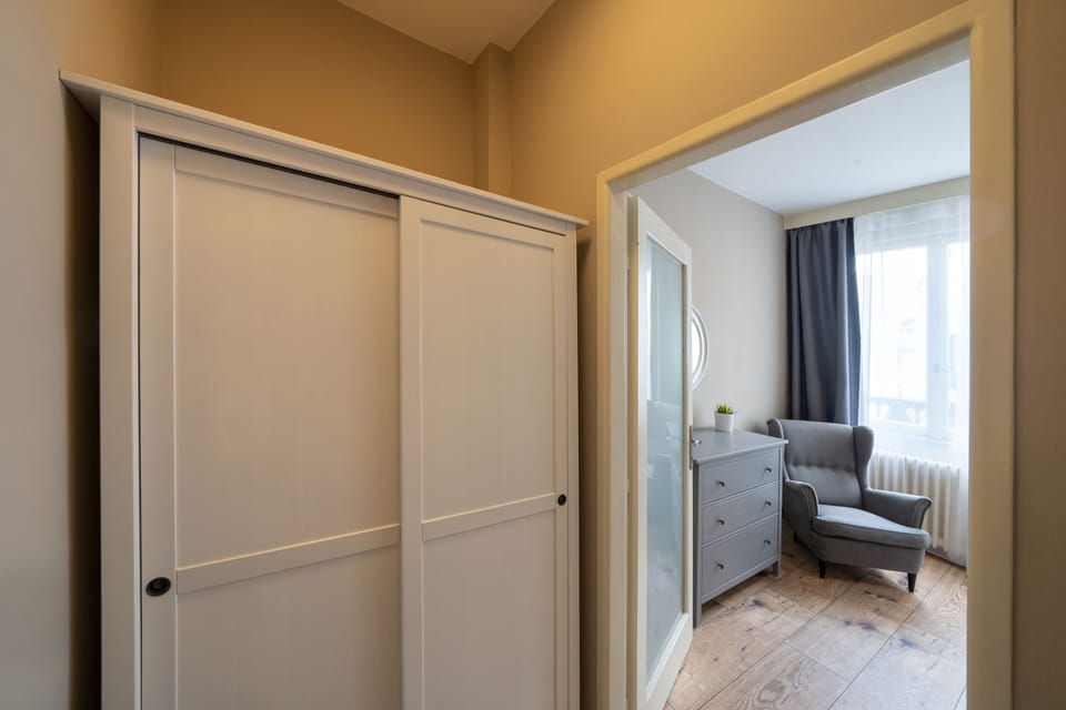 Bedroom 1 with balcony, double bed, wardrobe and work desk 