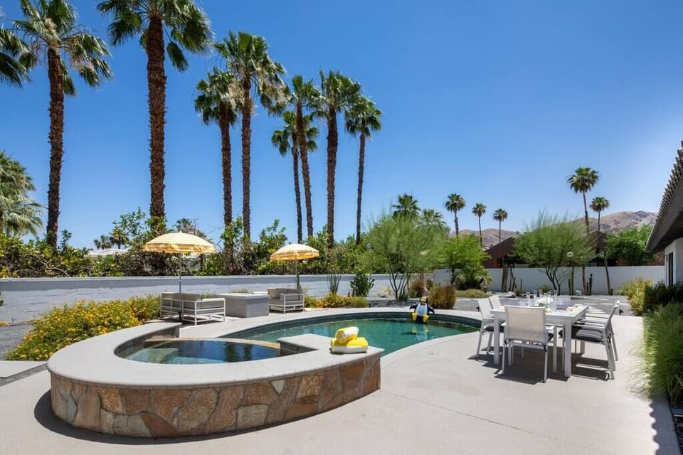 Outdoor area includes private pool/spa, fire pit, dining table, and daybed.