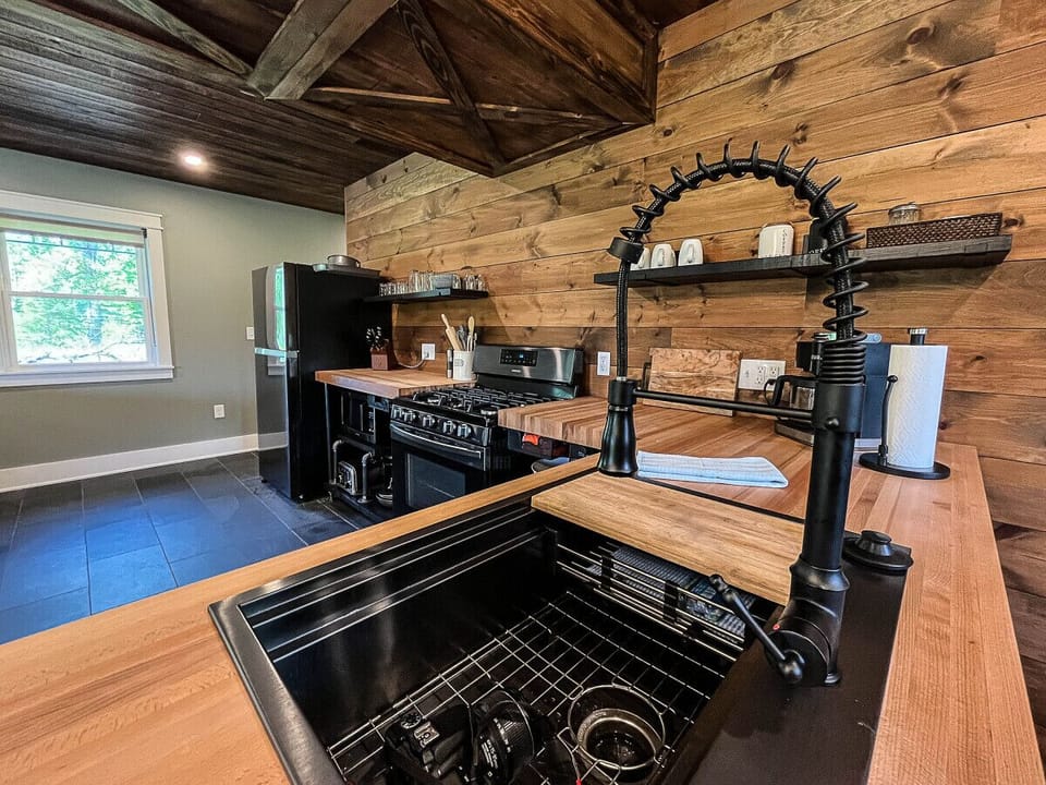 Chef-ready kitchen with 5-burner range, butcher block counters, and dining for 6.