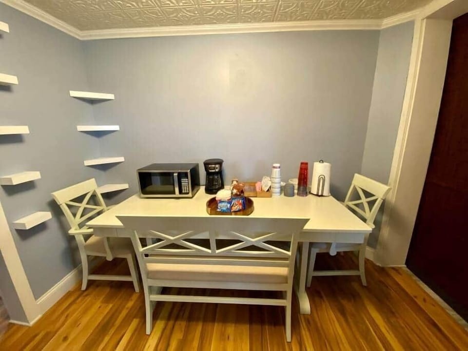 Microwave and coffeemaker (no kitchen) fridge is located in the mudroom