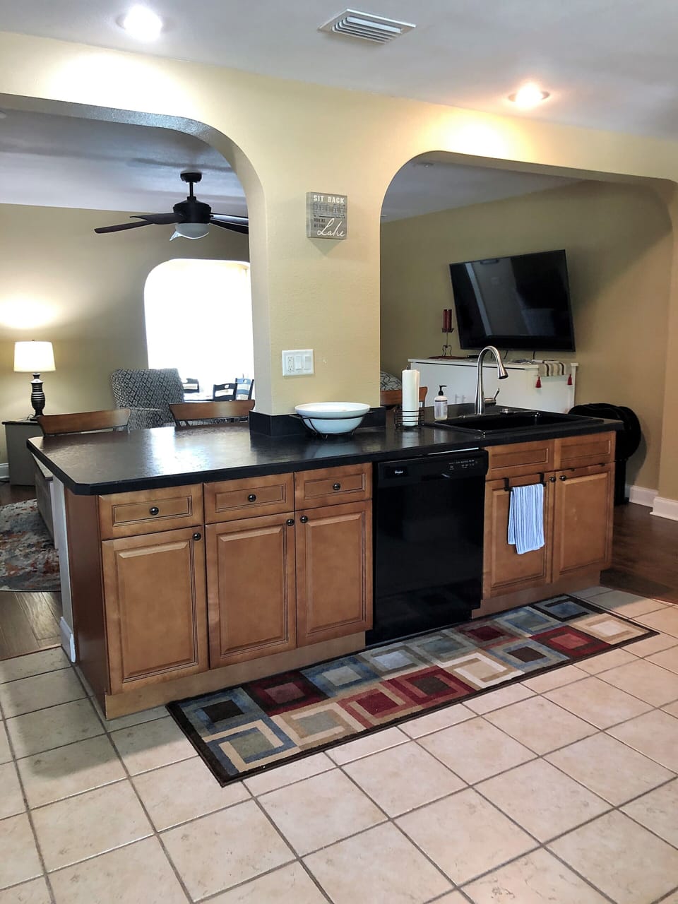Large kitchen with island looking into living room