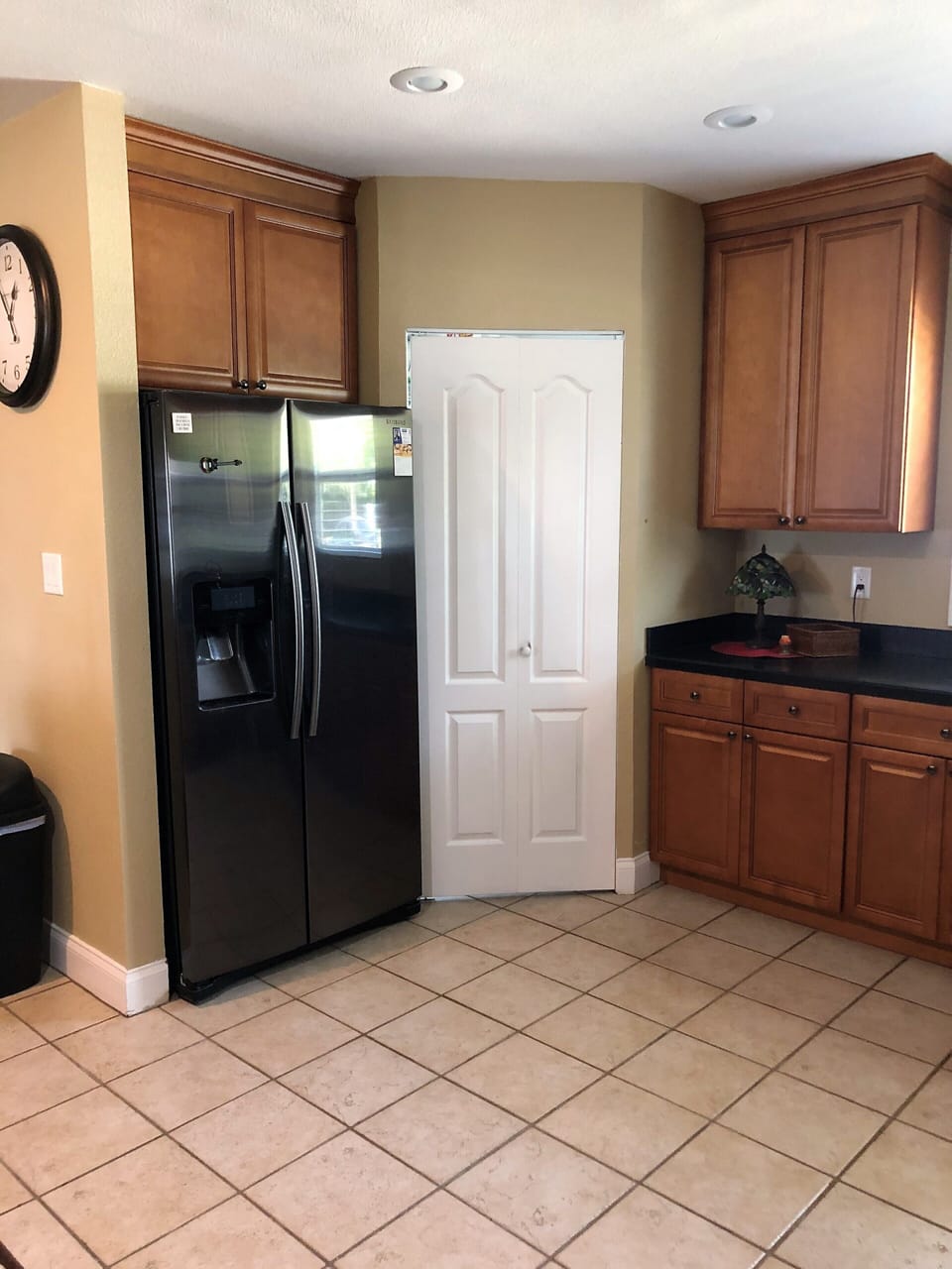 Full size refrigerator with ice and water in door.