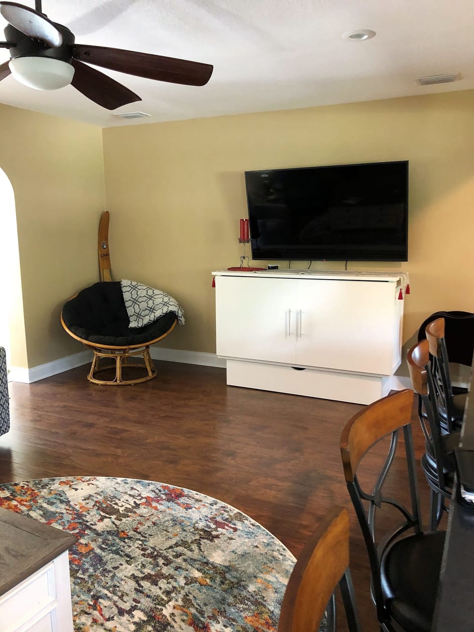 Large TV on top of queen size murphy bed. 