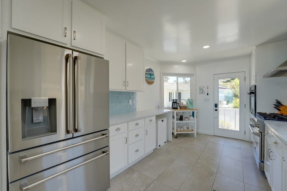 The kitchen at Blue Sea Villa is stocked with everything you need to prepare a meal at home! The 6 burner stove top and double ovens are perfect for preparing meals for large groups!