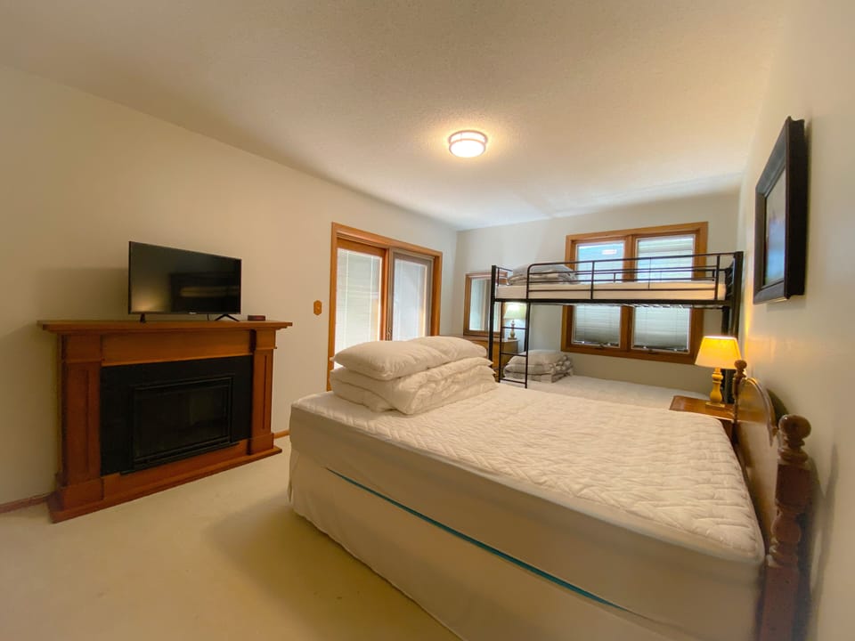 Bedroom 1:  queen bed, double bunk bed, Roku TV, balcony access, sleeps 4