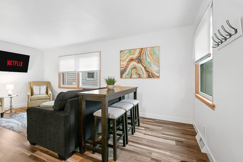 Featuring a bar counter for three and a captivating 55-inch Smart Roku TV. 