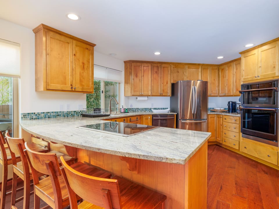 The chef's kitchen has large and small appliances to make a gourmet meal